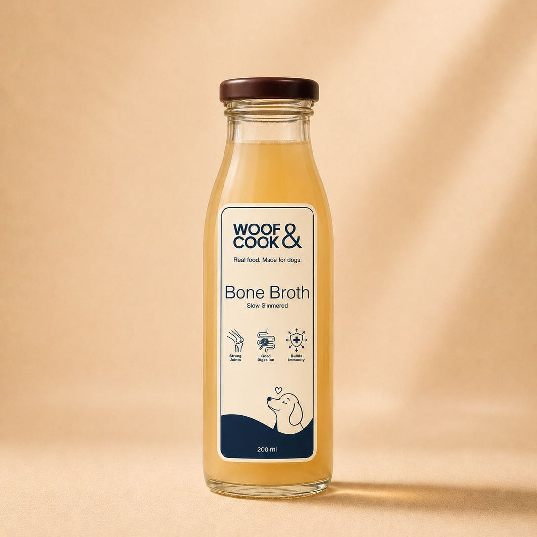 Bottle of Woof & Cook Bone Broth on a beige background